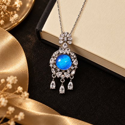 Blue Morpho butterfly wing halo necklace with silver setting and three teardrop accents, view 6