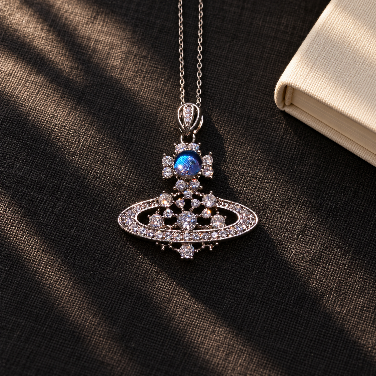 Blue Morpho Saturn necklace — styled display; props not included