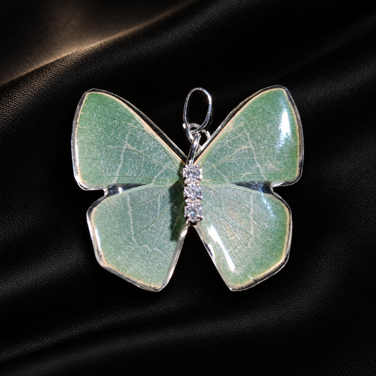 Real Green Moth Wing Necklace, Resin Pendant, Adjustable Sterling Silver Chain, Fairycore Gift — detail view on a dark studio background