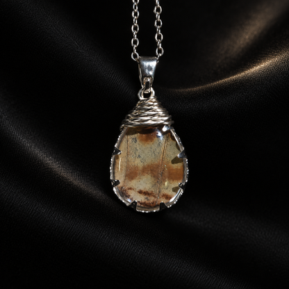 Real Morpho Butterfly Wing Teardrop Necklace, Sterling Silver Hypoallergenic Gift — detail view on a dark studio background