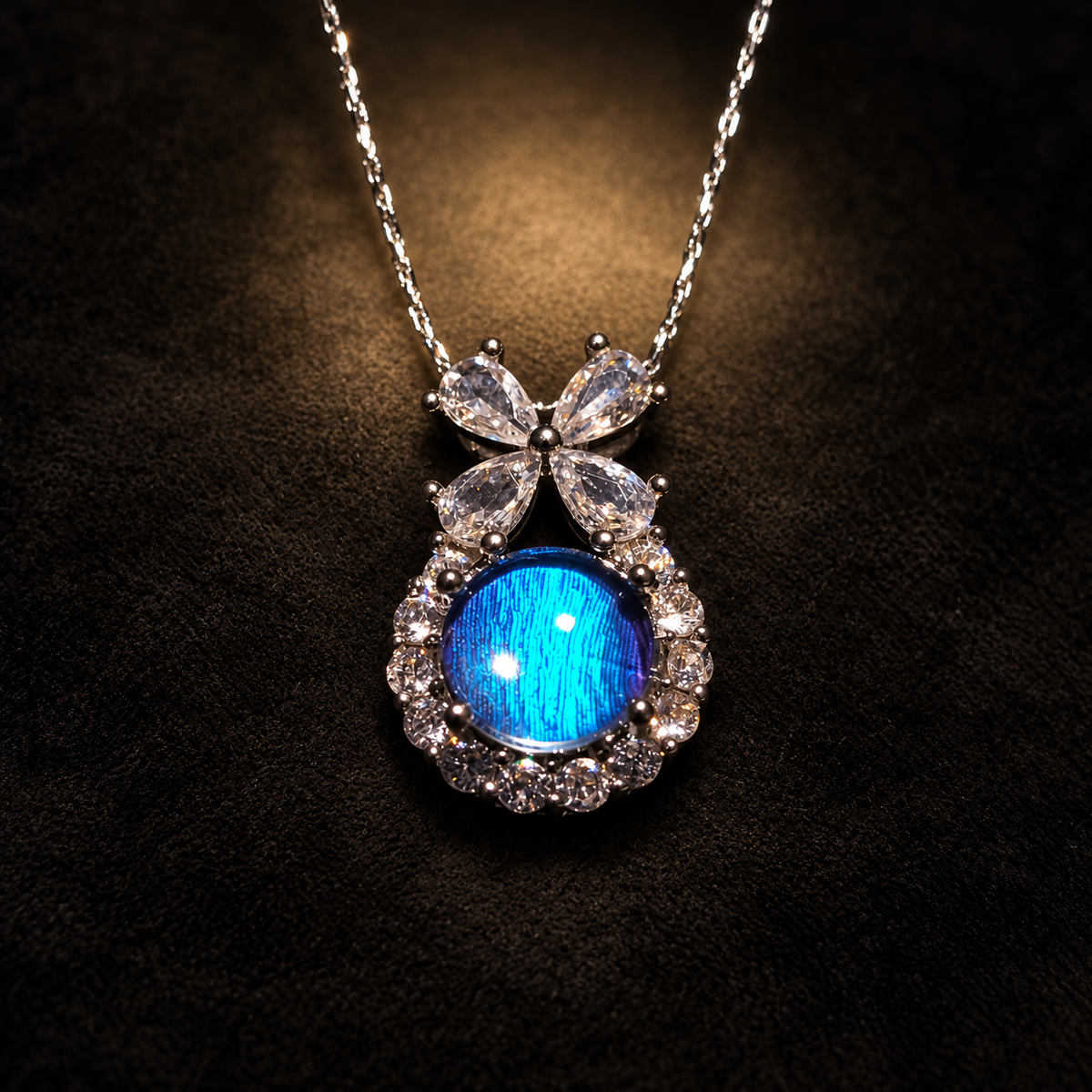 Blue Morpho butterfly wing bow necklace — black suede styled setting; styling props not included