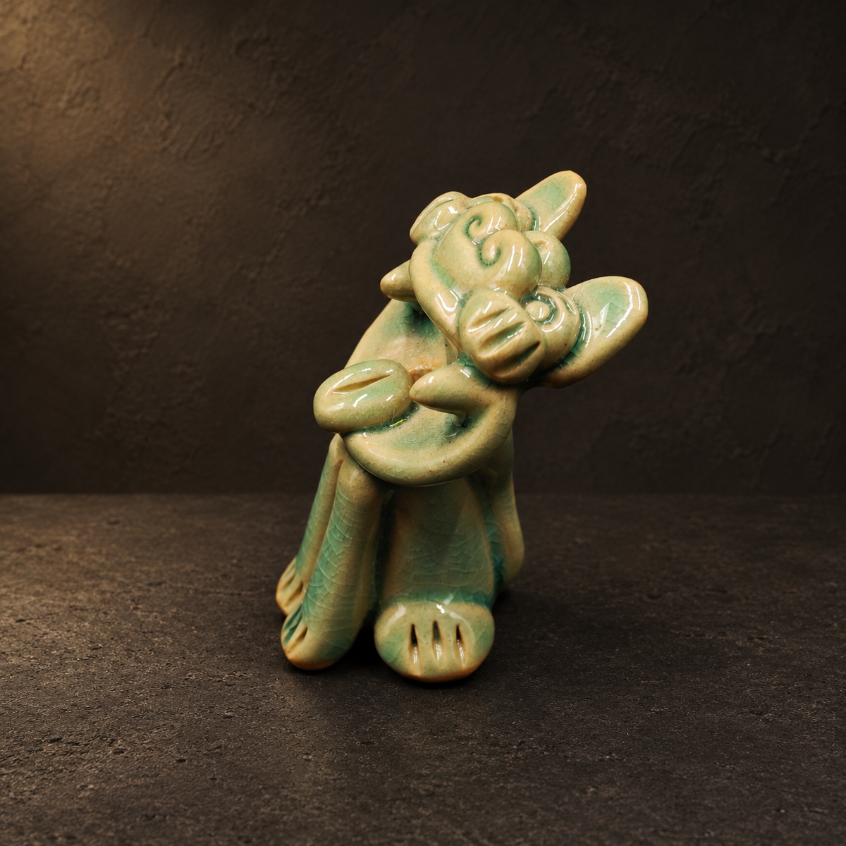 Green crackle-glaze Wamao guardian cat — Three-quarter side view