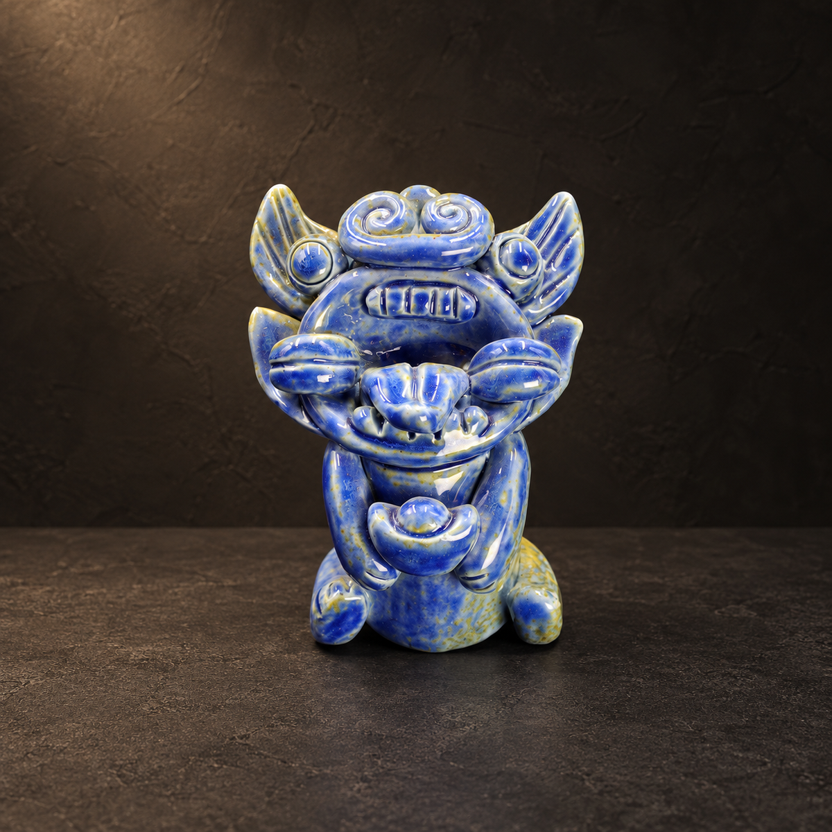 Blue-glazed ingot-holding Wamao guardian cat — Main front view