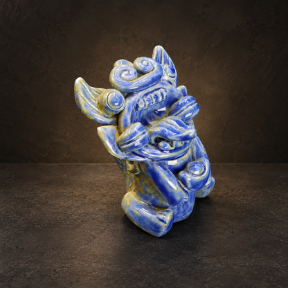 Blue-glazed ingot-holding Wamao guardian cat — Three-quarter side view