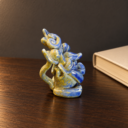 Blue-glazed ingot-holding Wamao guardian cat — Quiet reading corner scene
