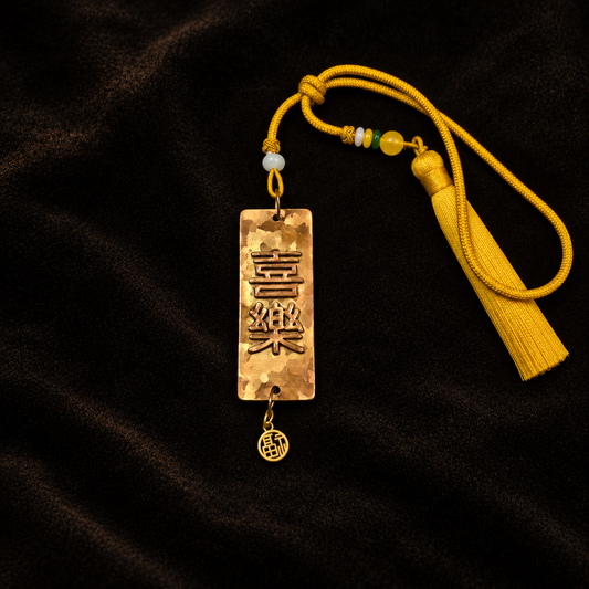 Peace & Joy Double-Sided Mottled Copper Blessing Charm — full product view on a dark studio background
