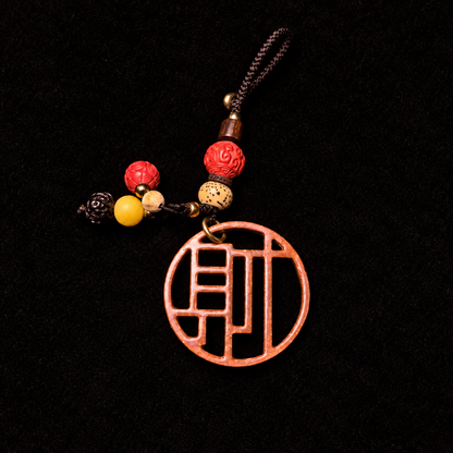 Bantong copper Cai bag charm — Top-down flat-lay