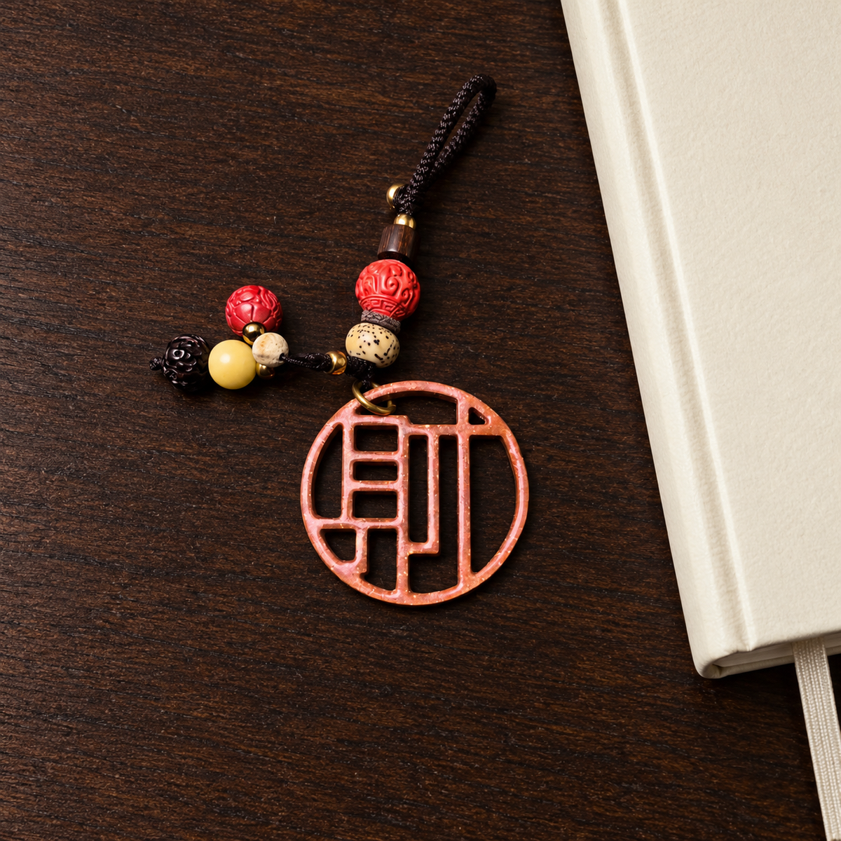 Bantong copper Cai bag charm — Journal desk scene