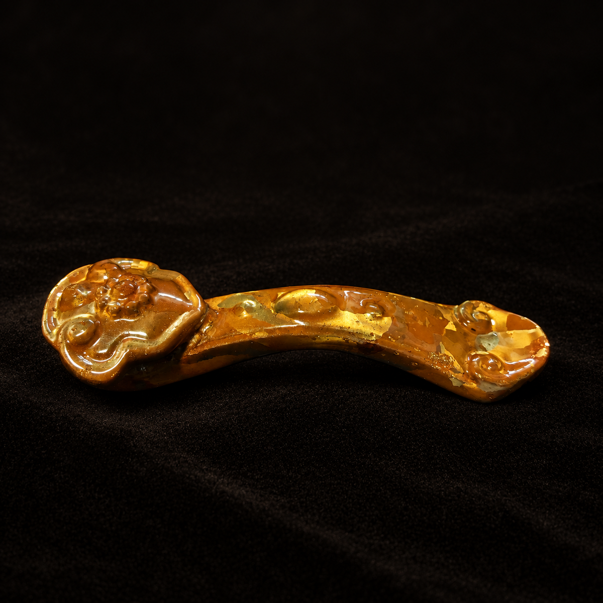 Chinese Ruyi Ornament, Bantong Metal Sculpture, Feng Shui Desk Decor — detail view on a dark studio background
